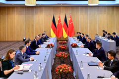 李强会见德国总理默茨